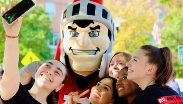 Group of students posing with RU Mascot